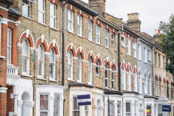 Estate agent signs displayed outside terraced houses in Harringay Ladder area, London Estate agent signs displayed outside terraced houses in harringay ladder area, london, england