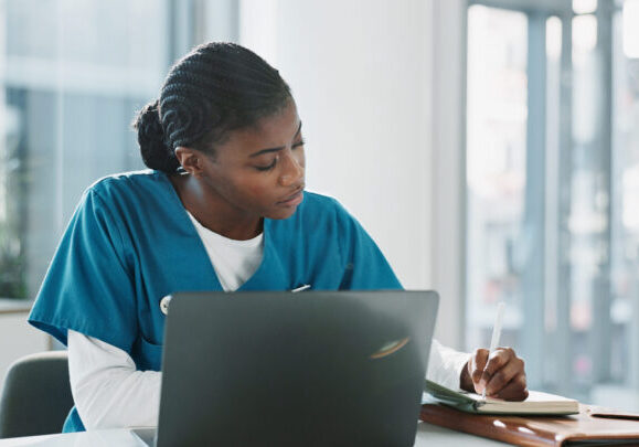 Hospital, doctor and black woman with laptop, writing and thinking with research, online reading and results. African person, medical or professional with computer, nurse and digital app with network
