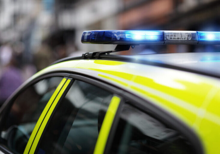 Police siren at accident or crime scene Police siren flashing blue lights at accident or crime scene